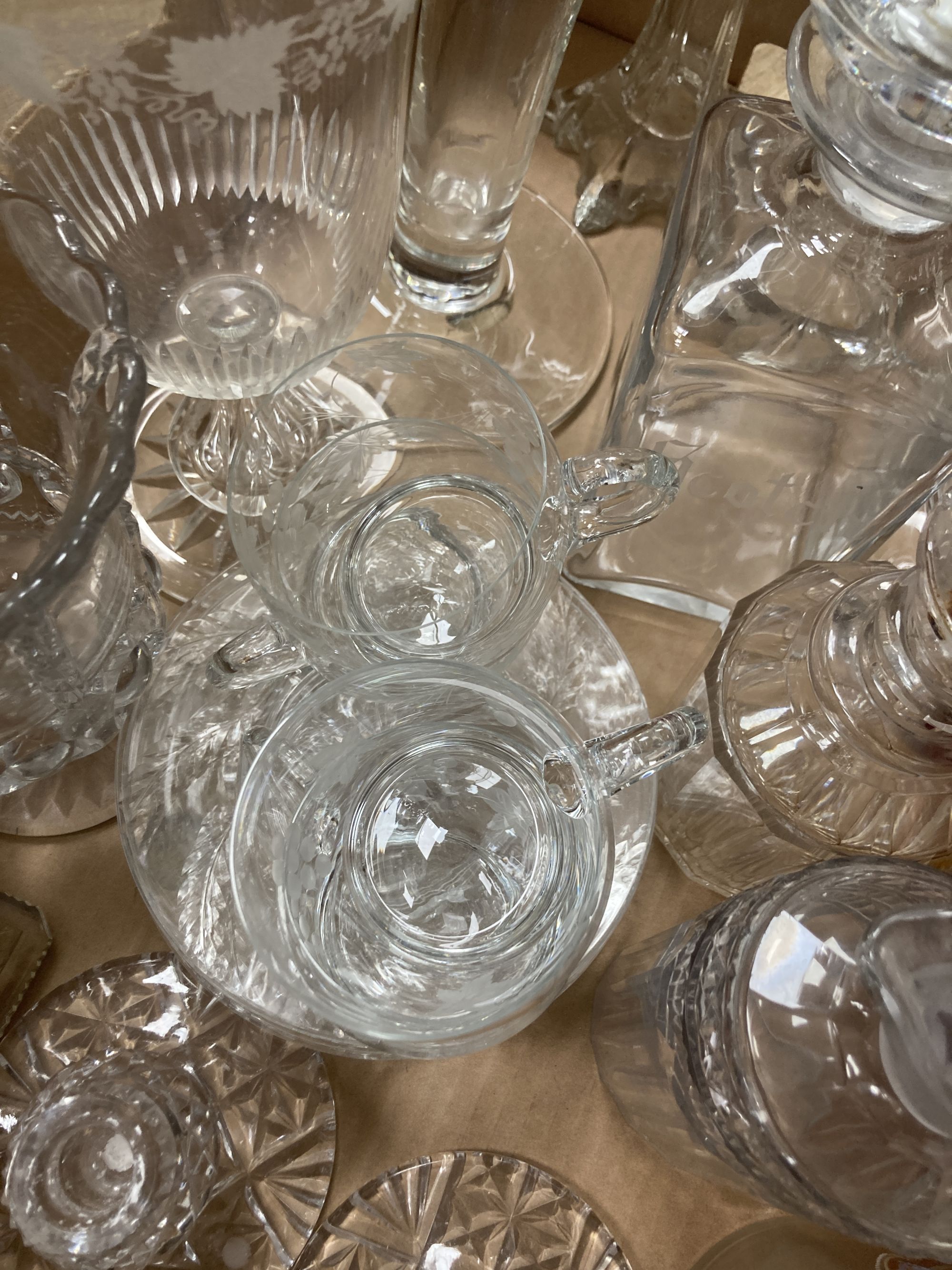 A quantity of mixed glassware, decanters, vases, etc.